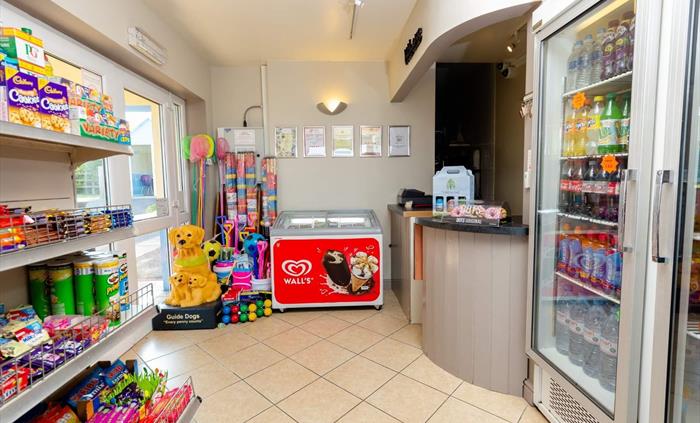 A small shop stocking essentials, gas, etc and a takeaway serving curries, pastas, and stone-baked pizzas, offering a wide range of dishes to suit mos